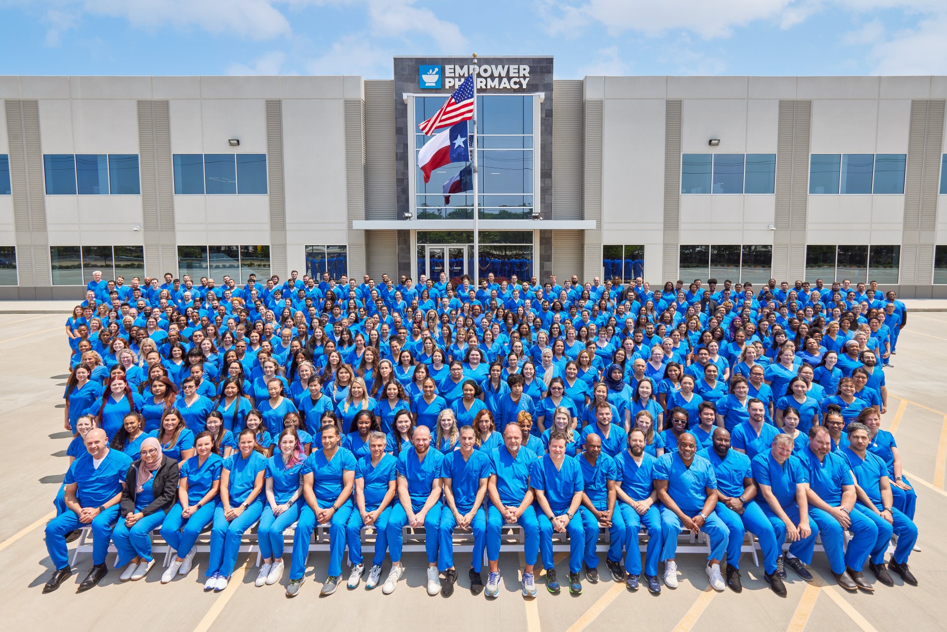 1920×1281 A picture of a large group of employee in front of empower pharmacy