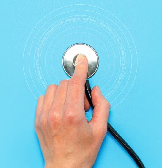 A hand holding a stethoscope