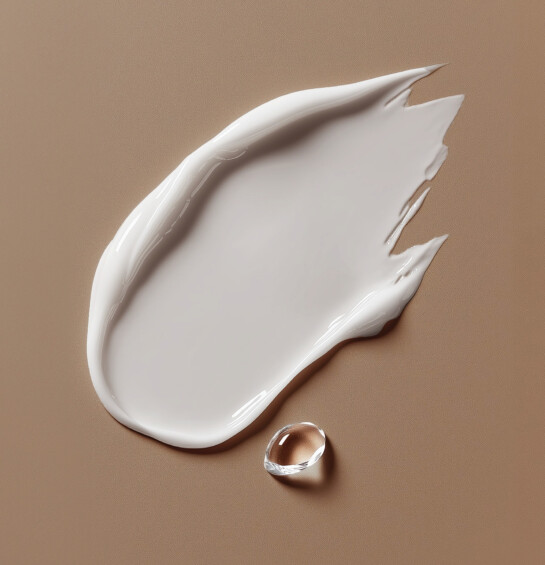 A cream with a drop of water next to it with text "pairing science with beauty"